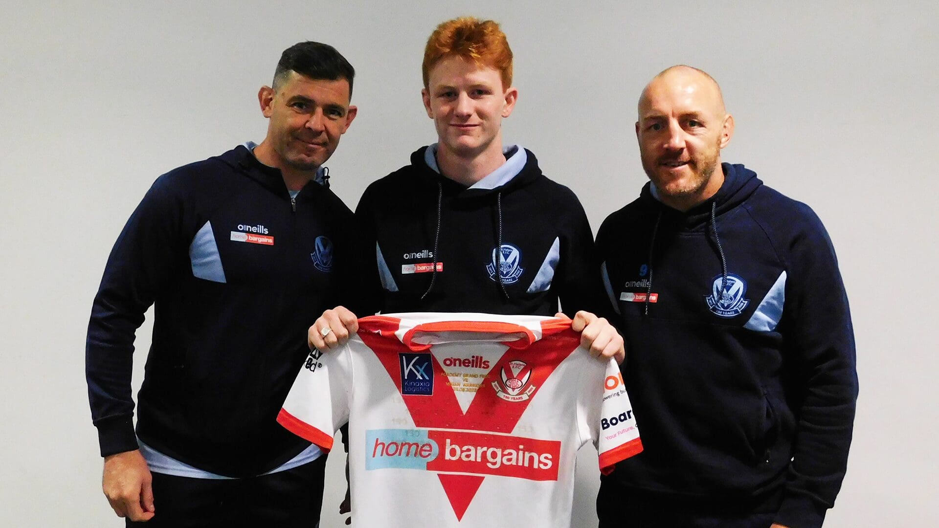 their St.Helens Wellens Grand | Final present Roby & Academy shirts